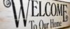 A stylish rustic wooden welcome sign perfect for home decoration.